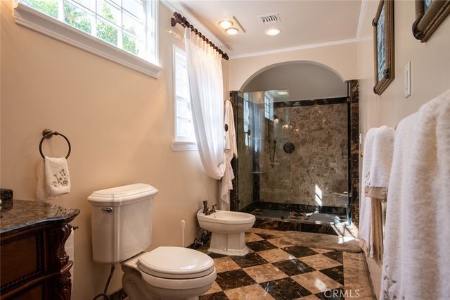 a view of a white building with a swimming pool