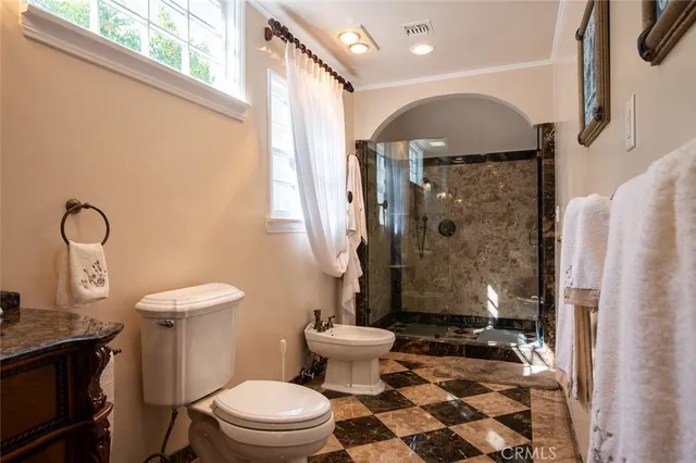 a view of a white building with a swimming pool