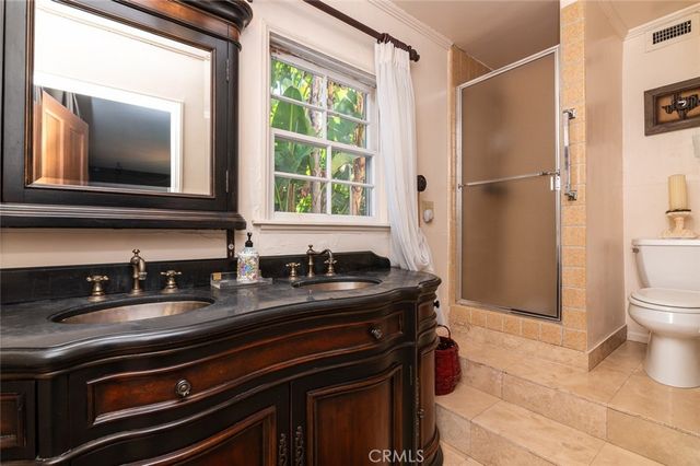 an aerial view of residential house with outdoor space and swimming pool