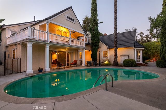 an aerial view of residential house with green space