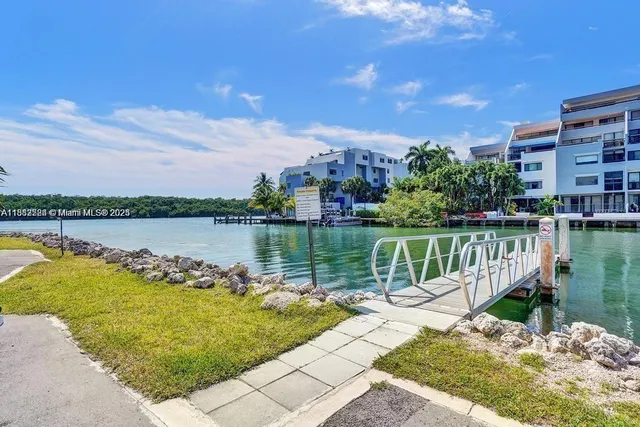 a view of a lake with a house in the background