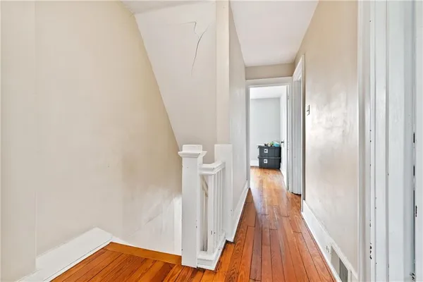 a view of a bedroom from a hallway