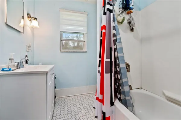 a bathroom with a sink and a bathtub
