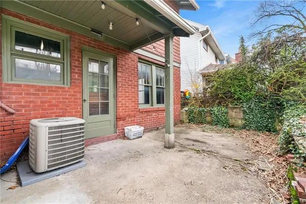 a view of a backyard with a garden and plants