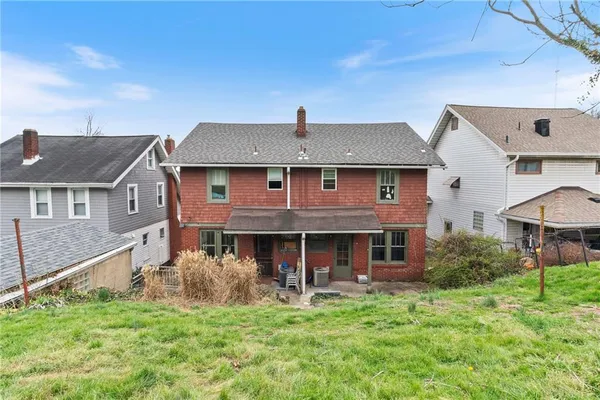 a front view of a house with a yard