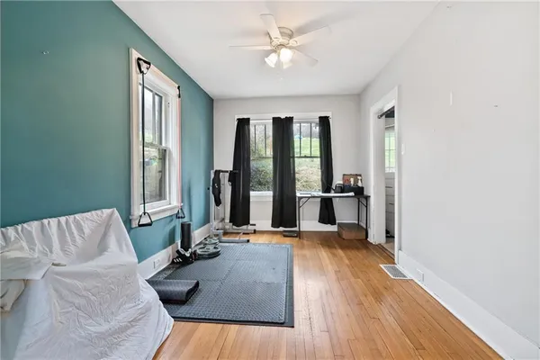 a living room with furniture and large windows