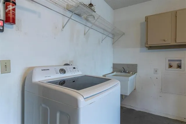 a utility room with dryer and washer