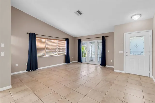 a view of an empty room with a window