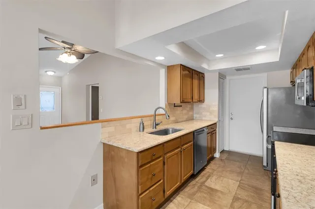 a bathroom with a sink a mirror and a shower