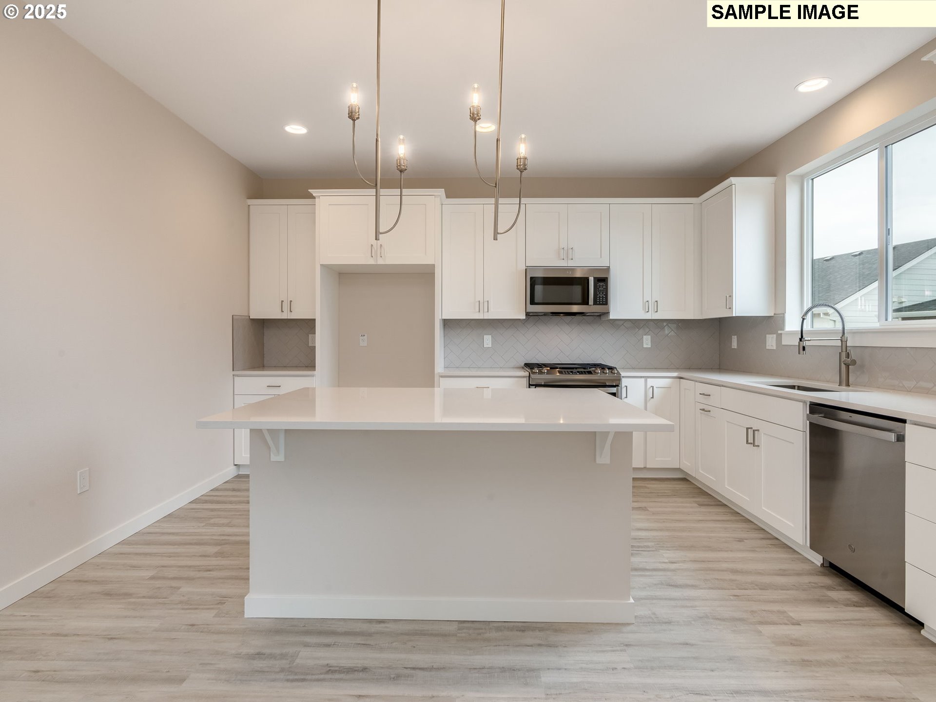 2111 Northeast Ridge Run Lane Estacada, OR 97023 - Photo 3 of 45 a kitchen with kitchen island white cabinets and stainless steel appliances