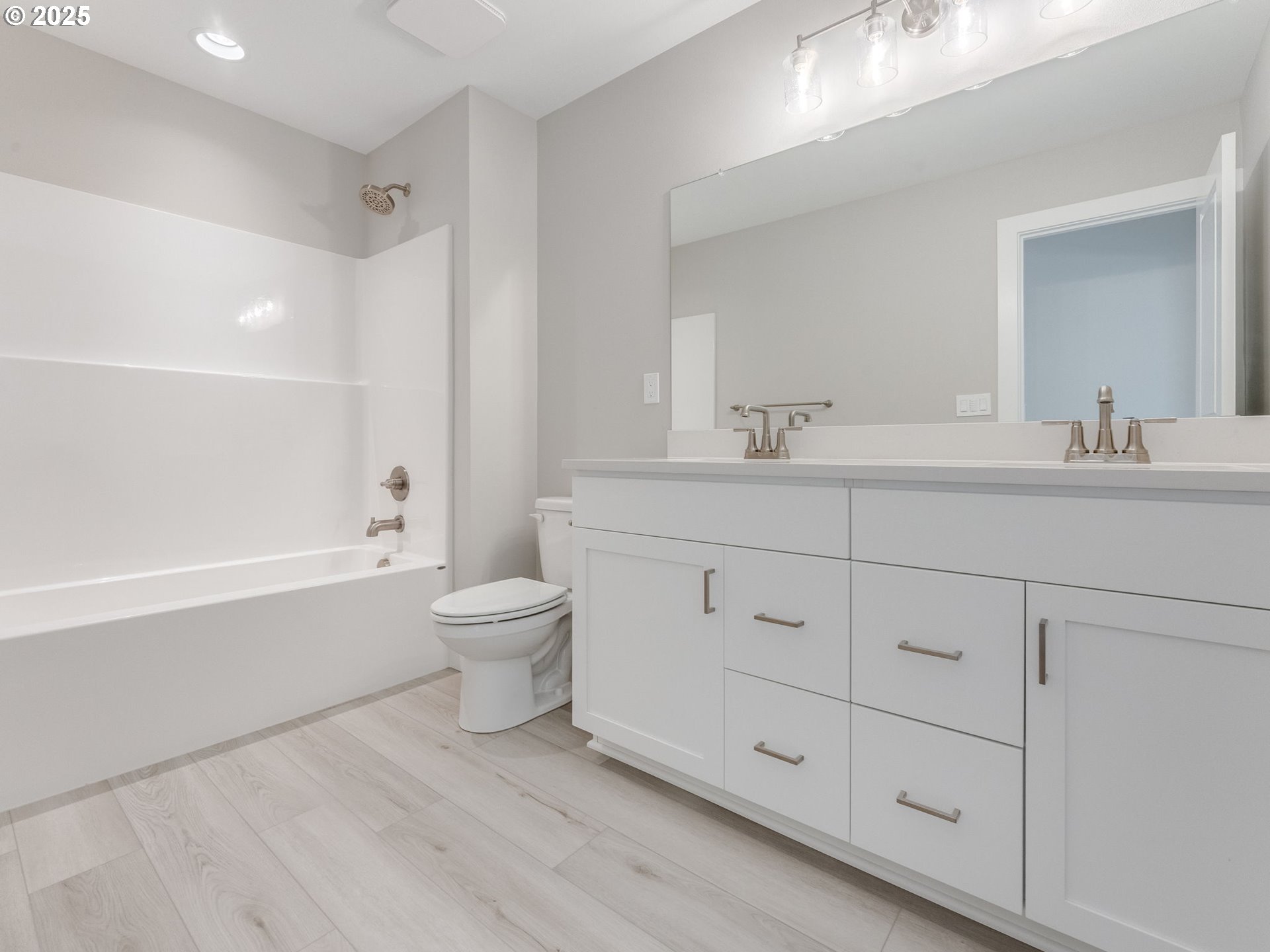 2111 Northeast Ridge Run Lane Estacada, OR 97023 - Photo 35 of 45 a bathroom with a toilet a sink and bathtub