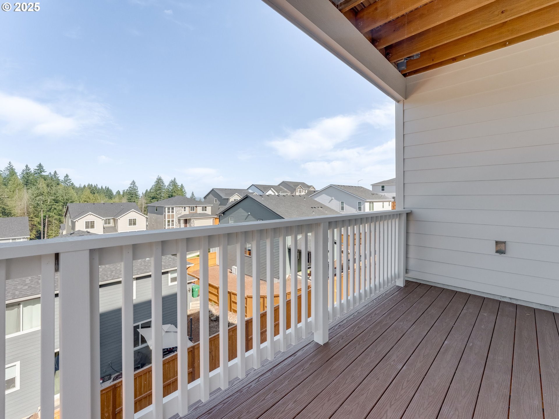 2111 Northeast Ridge Run Lane Estacada, OR 97023 - Photo 42 of 45 a view of a balcony with wooden floor and fence