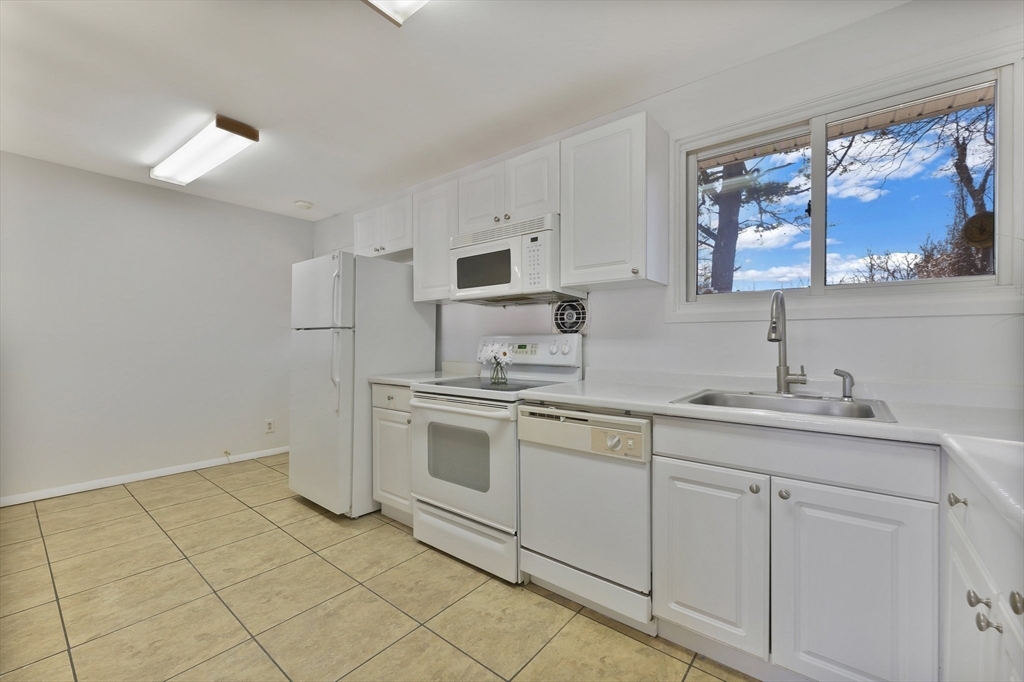 51 Broadleaf Lane Enfield, CT 06082 - Photo 2 of 36 a kitchen with a sink cabinets and window