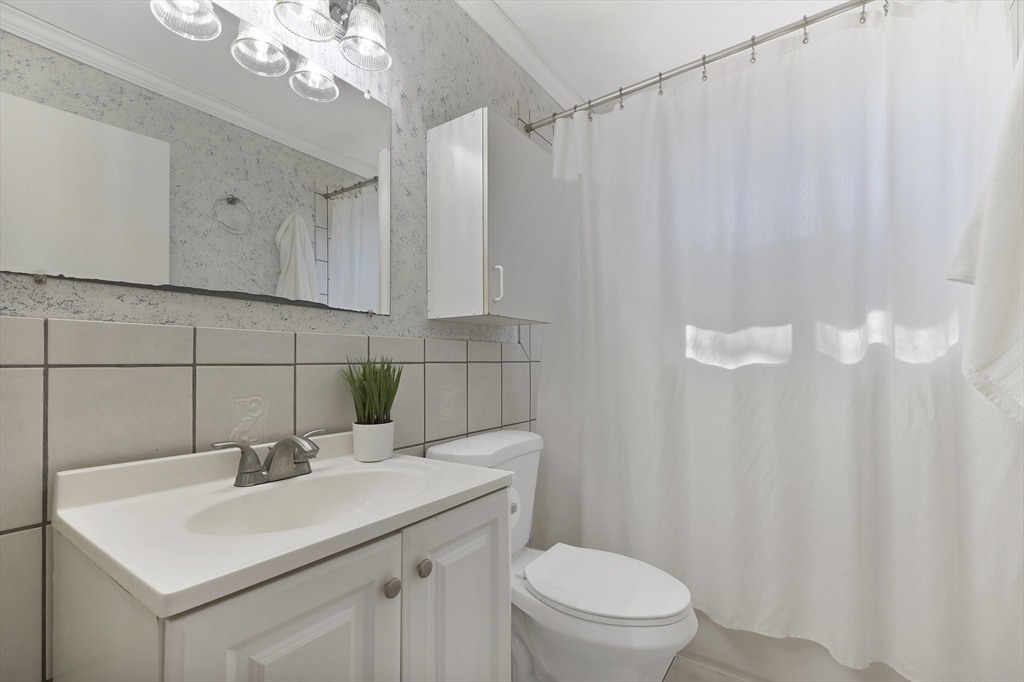 51 Broadleaf Lane Enfield, CT 06082 - Photo 22 of 36 a bathroom with a sink a toilet and shower