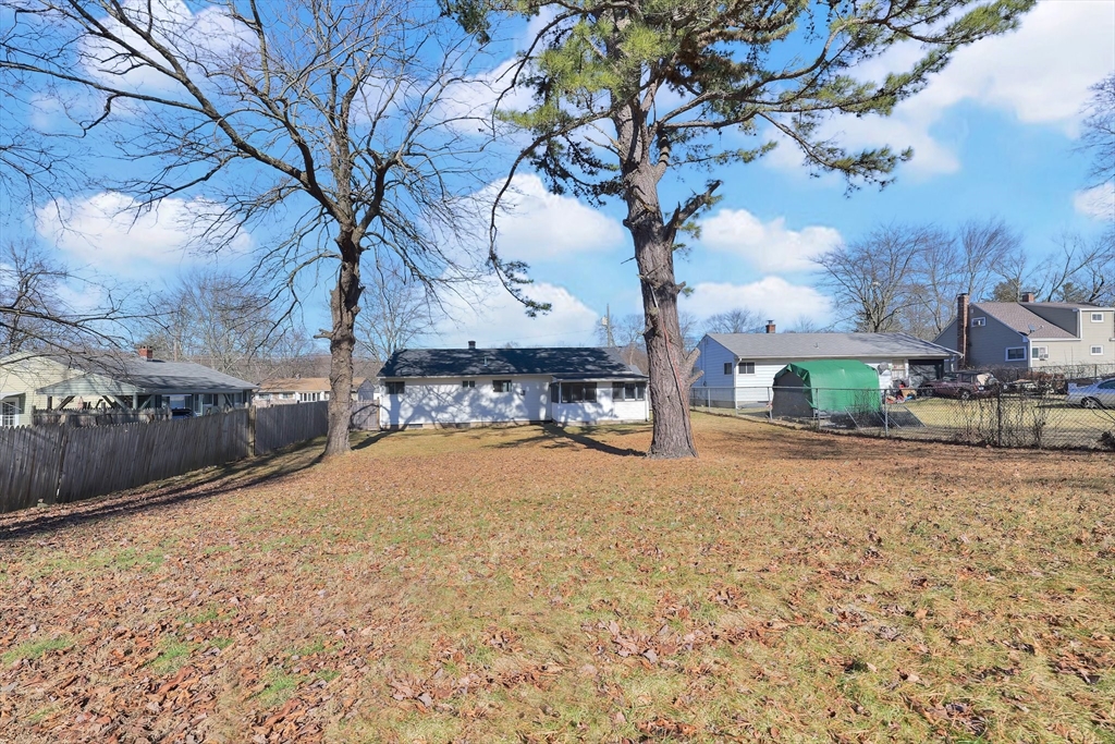51 Broadleaf Lane Enfield, CT 06082 - Photo 34 of 36 a view of backyard with large trees and plants