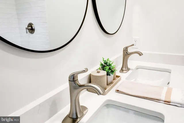 a bathroom with a sink and mirror