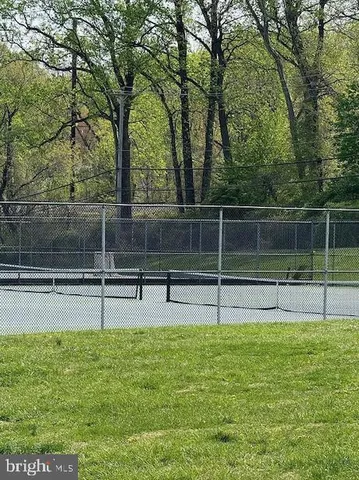 a view of a swimming pool with a yard