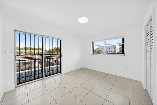 a view of empty room with windows