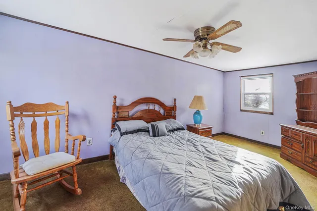 an empty room with closet and a window