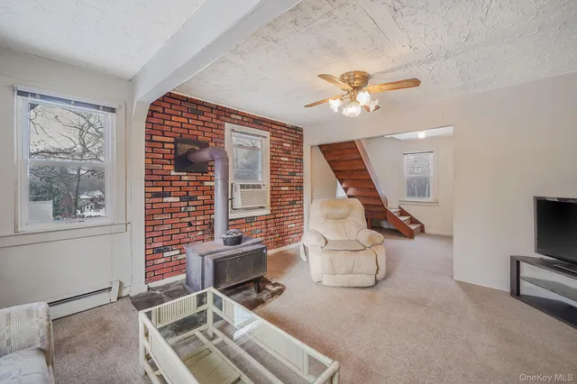 a workspace with furniture and ceiling fan