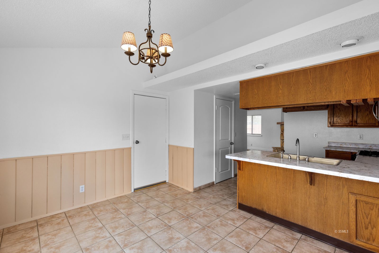 833 Charles Court Ridgecrest, CA 93555 - Photo 10 of 30 a kitchen with a sink and a stove top oven
