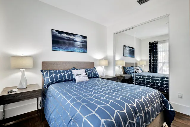 a bedroom with a large bed and a window