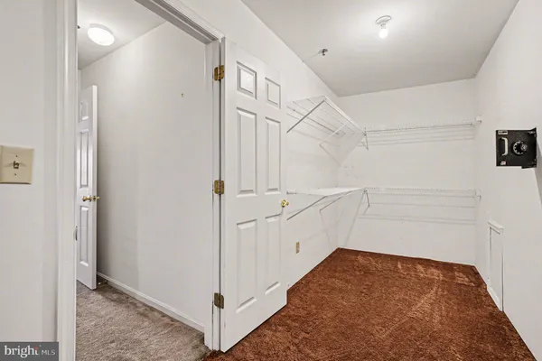 a view of a hallway with white walls