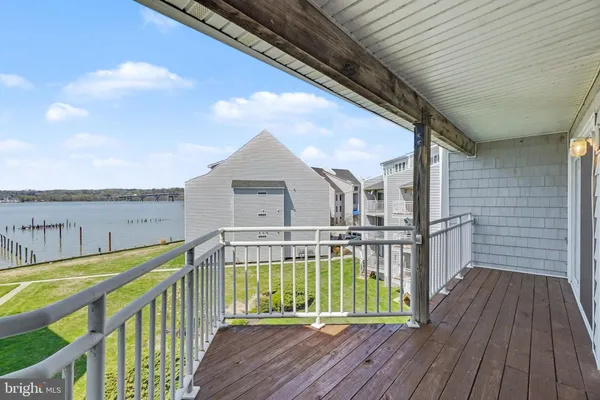 a view of balcony with wooden floor