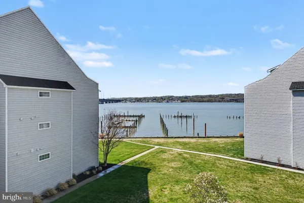 a swimming pool with outdoor seating and yard