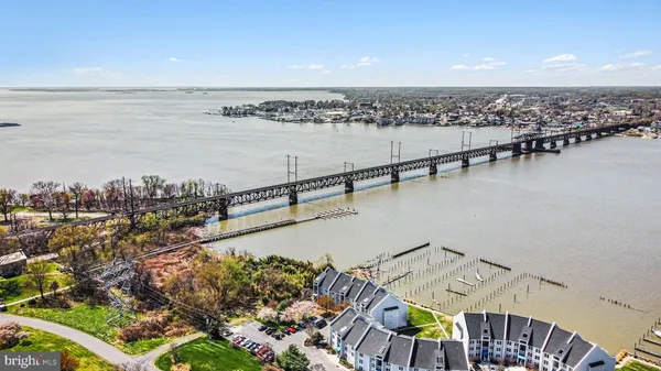 a view of balcony with wooden floor and fence