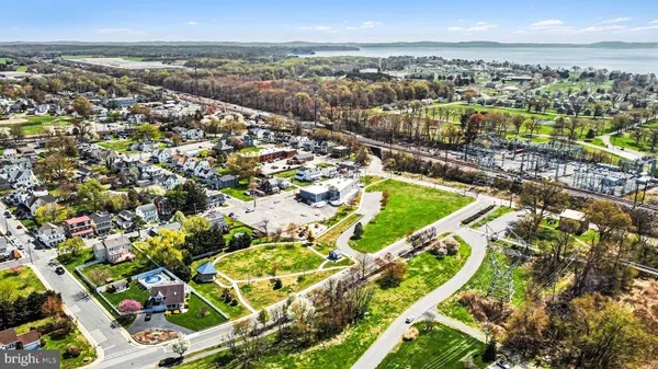 a house view with swimming pool in front of it