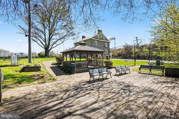 front view of a brick house with a yard