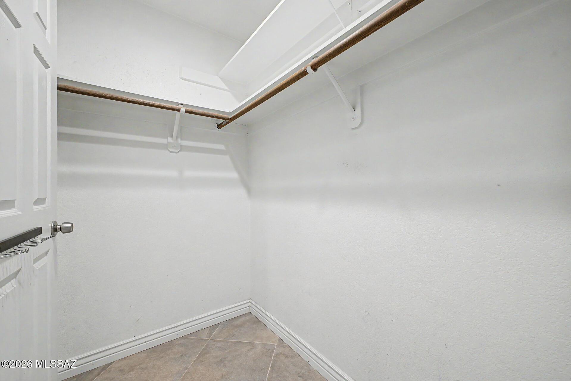 7550 East Rio Verde Drive Tucson, AZ 85715 - Photo 16 of 25 The walk-in closet provides plenty of storage for every season and every wardrobe.