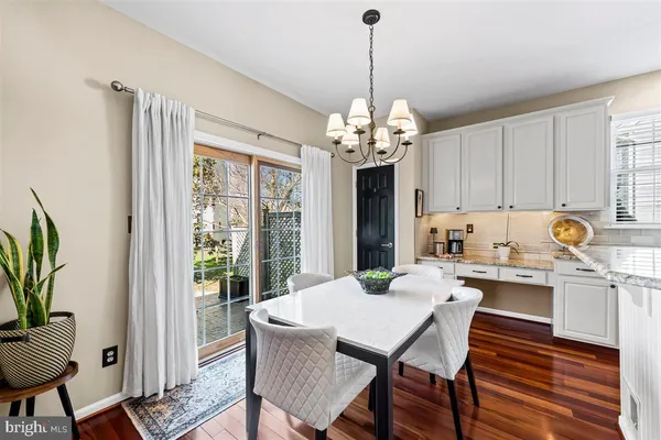 a kitchen with sink stove and microwave