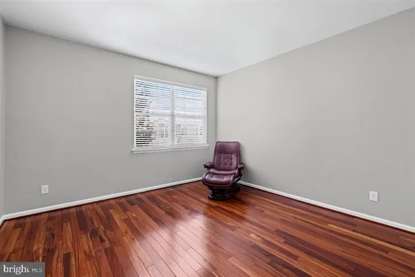 a view of living room with furniture and a fireplace