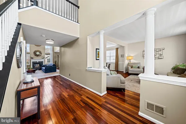 a living room with furniture a rug and a table