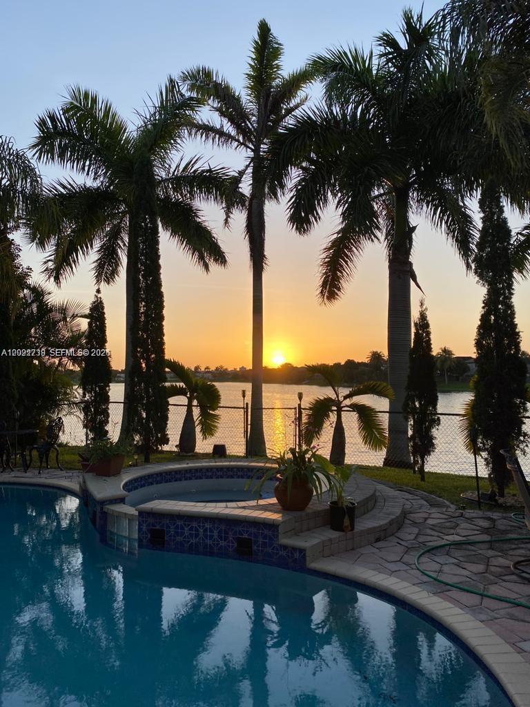 13553 Southwest 124th Avenue Road Miami, FL 33186 - Photo 1 of 31 a view of a lake with palm trees