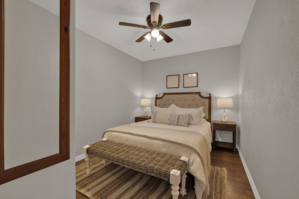 113 Weitz Road Fredericksburg, TX 78624 - Photo 20 of 50 a bedroom with a bed and a ceiling fan