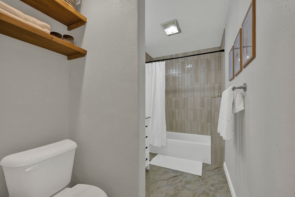 113 Weitz Road Fredericksburg, TX 78624 - Photo 21 of 50 a bathroom with a toilet and a shower