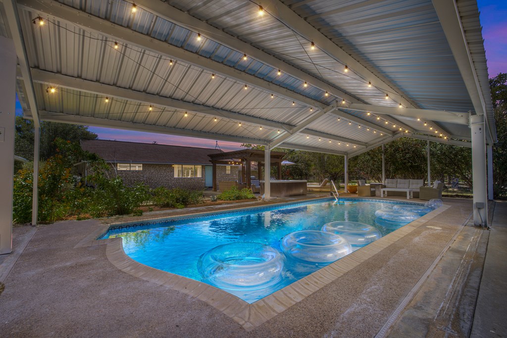 113 Weitz Road Fredericksburg, TX 78624 - Photo 22 of 50 a view of a swimming pool with a patio