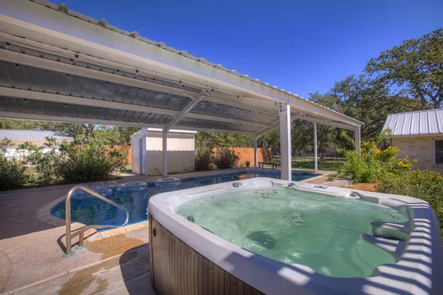 a view of house with backyard outdoor seating and plants