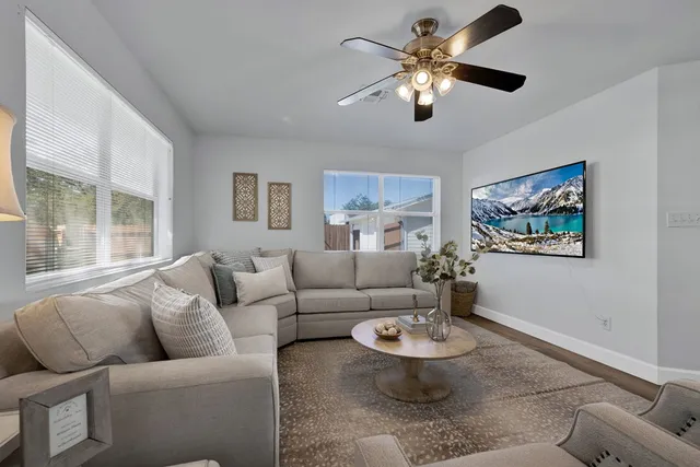a living room with furniture and a large window