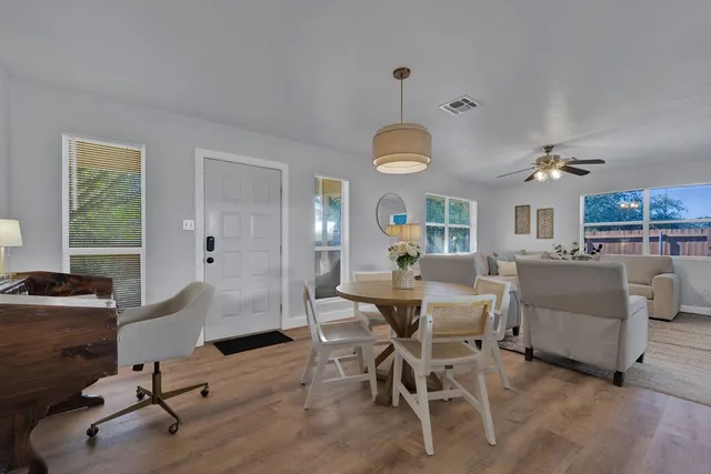 a view of a livingroom with furniture and a window
