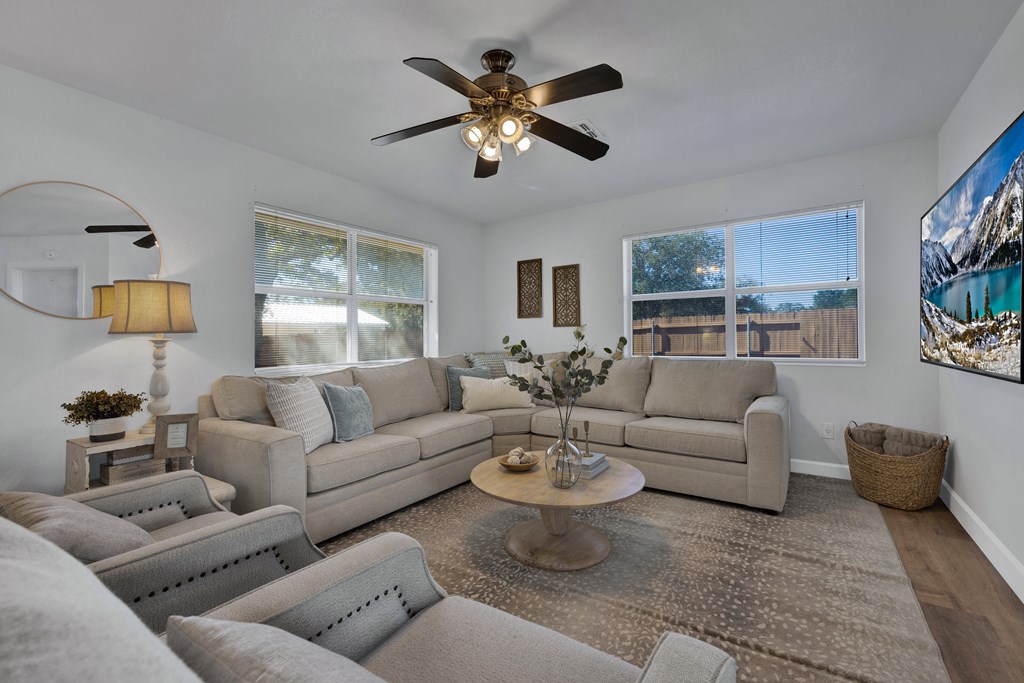 113 Weitz Road Fredericksburg, TX 78624 - Photo 37 of 50 a living room with furniture a ceiling fan and a window