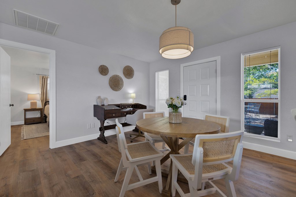 113 Weitz Road Fredericksburg, TX 78624 - Photo 41 of 50 a view of a dining room with furniture and wooden floor