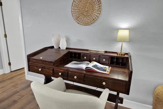 a bedroom with a bed and a lamp on table