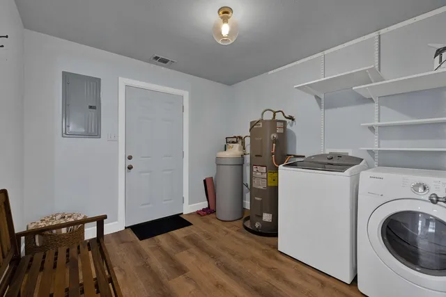 a view of a storage & utility room with washer and dryer