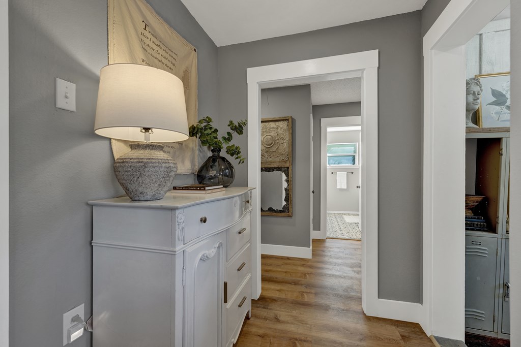 113 Weitz Road Fredericksburg, TX 78624 - Photo 7 of 50 a room with wooden floor and potted plant