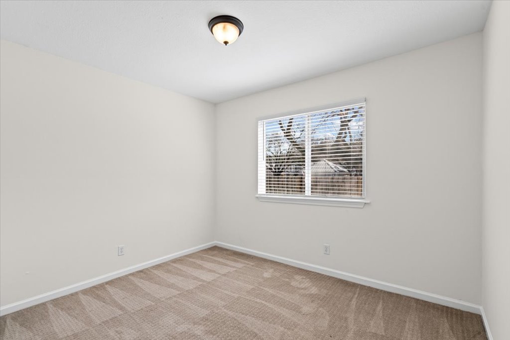 303 Fantail Loop, Unit A Austin, TX 78734 - Photo 16 of 28 an empty room with a window