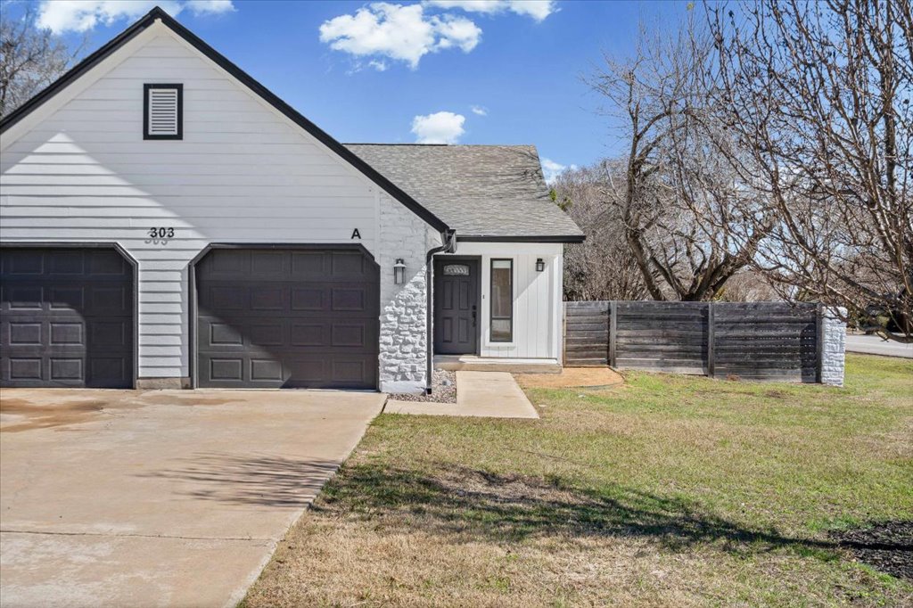 303 Fantail Loop, Unit A Austin, TX 78734 - Photo 2 of 28 a view of a house with a yard